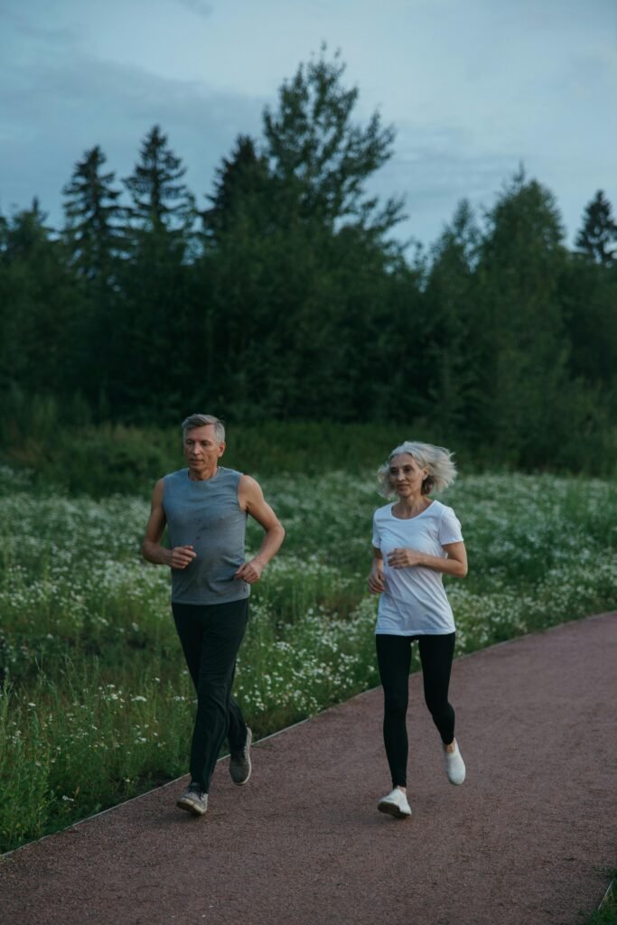 man and woman running outside for fitness